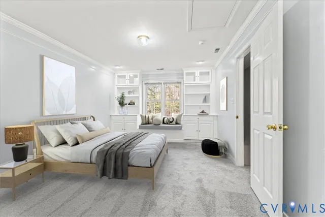 a spacious bedroom with a bed a couch and a window