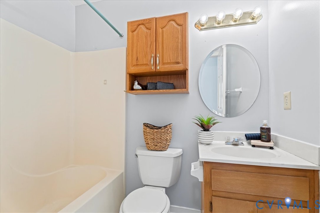 2739 Ridgeview Road Powhatan, VA 23139 - Photo 22 of 42 a bathroom with a sink a toilet and a mirror