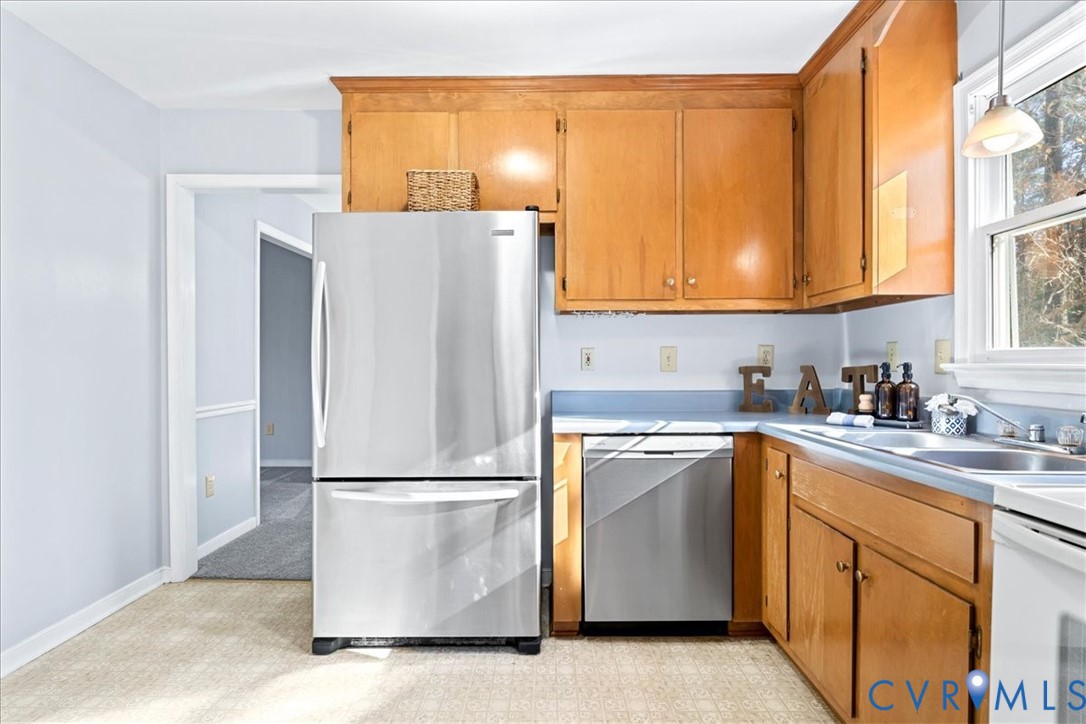 2739 Ridgeview Road Powhatan, VA 23139 - Photo 9 of 42 a kitchen with a refrigerator sink and cabinets