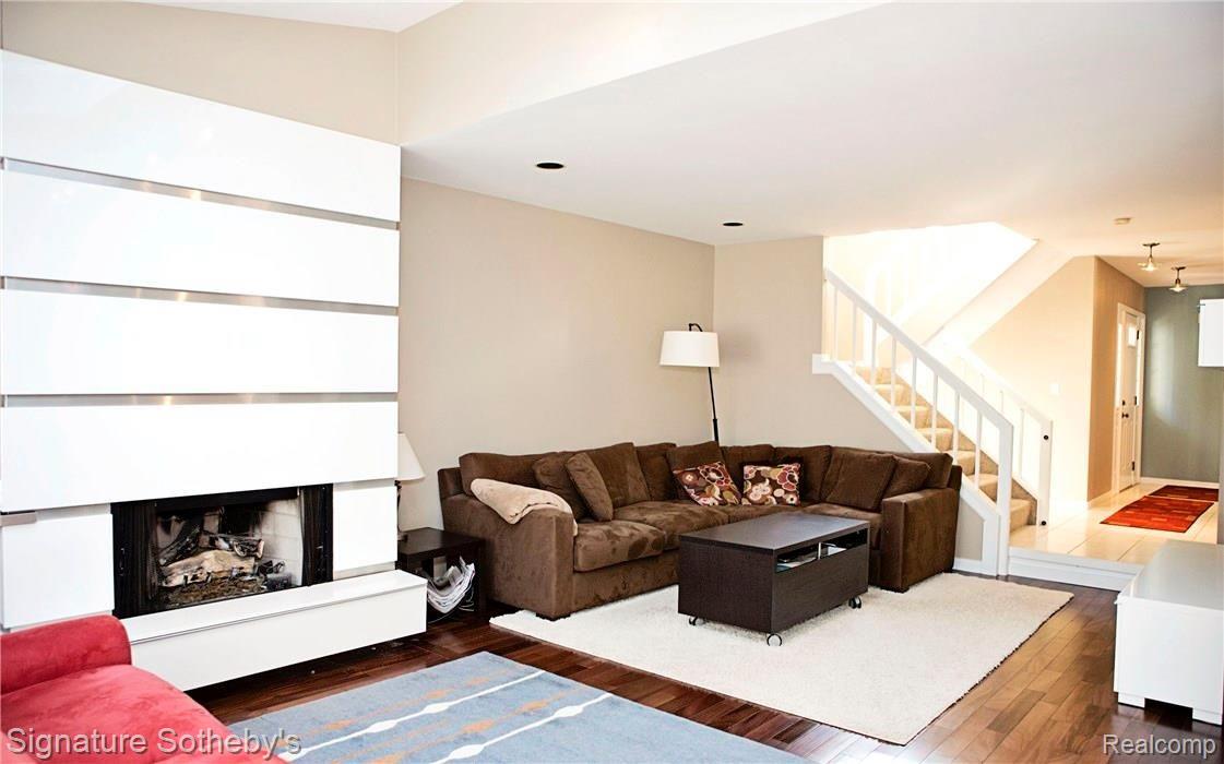 651 Ruffner Avenue Birmingham, MI 48009 - Photo 10 of 35 Large living room and family room with contemporary style custom mill work surround and gas fireplace