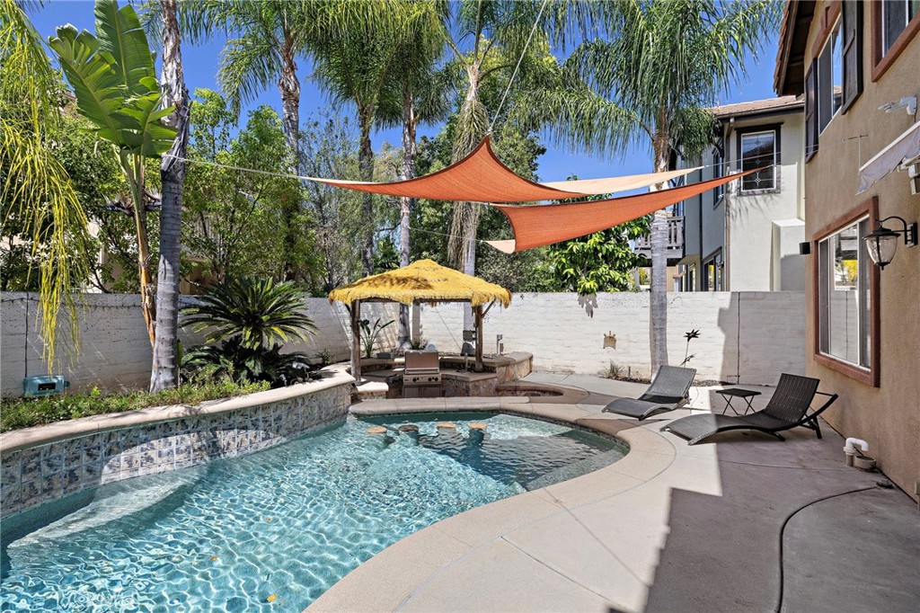 11625 Allen Tustin, CA 92782 - Photo 21 of 45 a view of a patio with a table and chairs under an umbrella