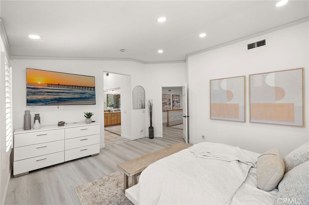 11625 Allen Tustin, CA 92782 - Photo 26 of 45 a spacious bedroom with a bed and a flat screen tv