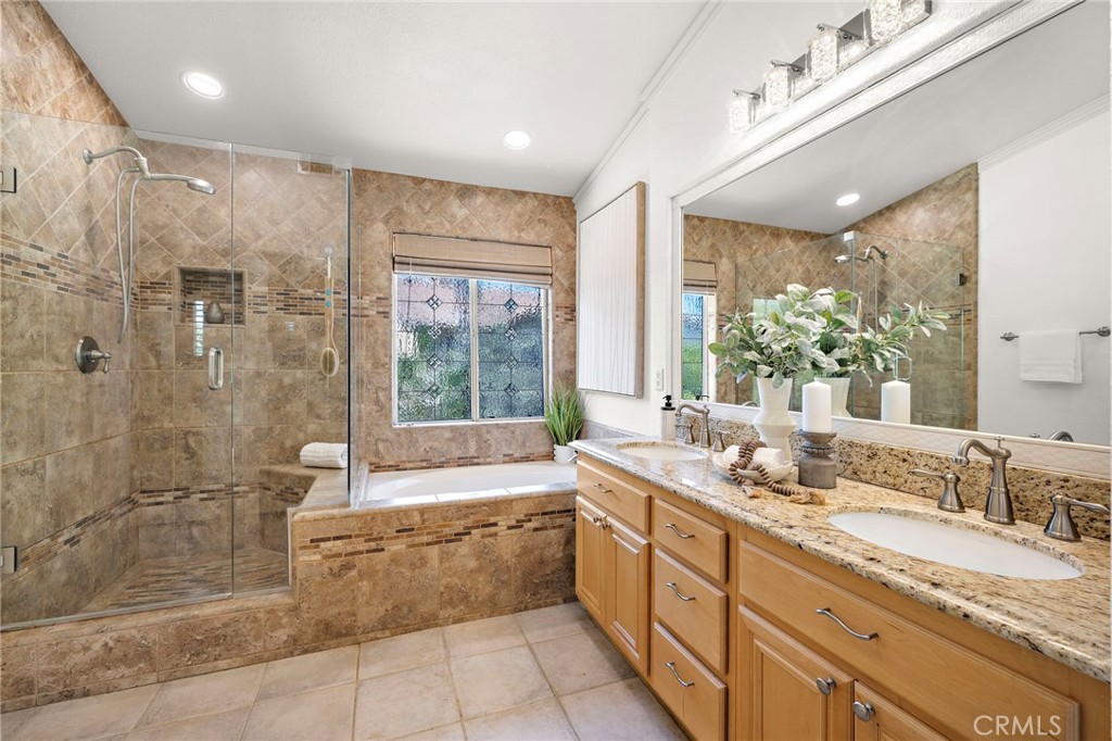11625 Allen Tustin, CA 92782 - Photo 28 of 45 a large bathroom with a granite countertop tub sink shower and mirror