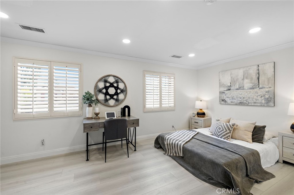 11625 Allen Tustin, CA 92782 - Photo 30 of 45 a bedroom with a bed and a table in it with window
