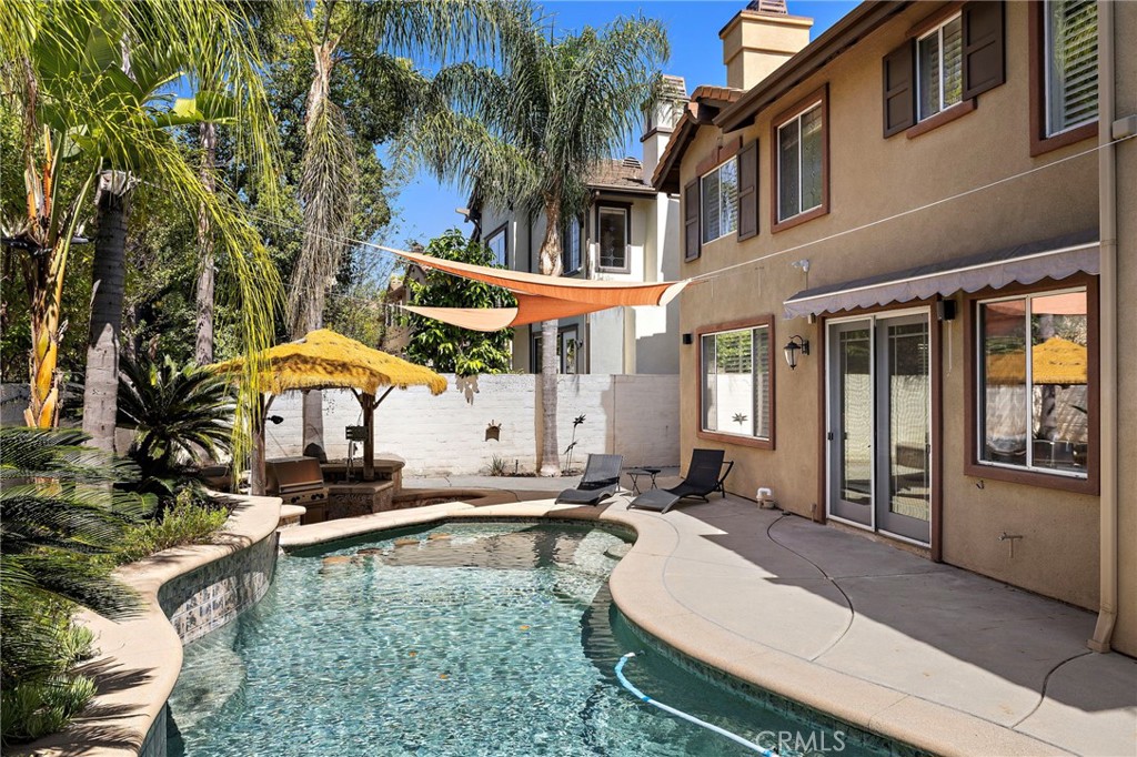 11625 Allen Tustin, CA 92782 - Photo 5 of 45 a swimming pool with outdoor seating and yard