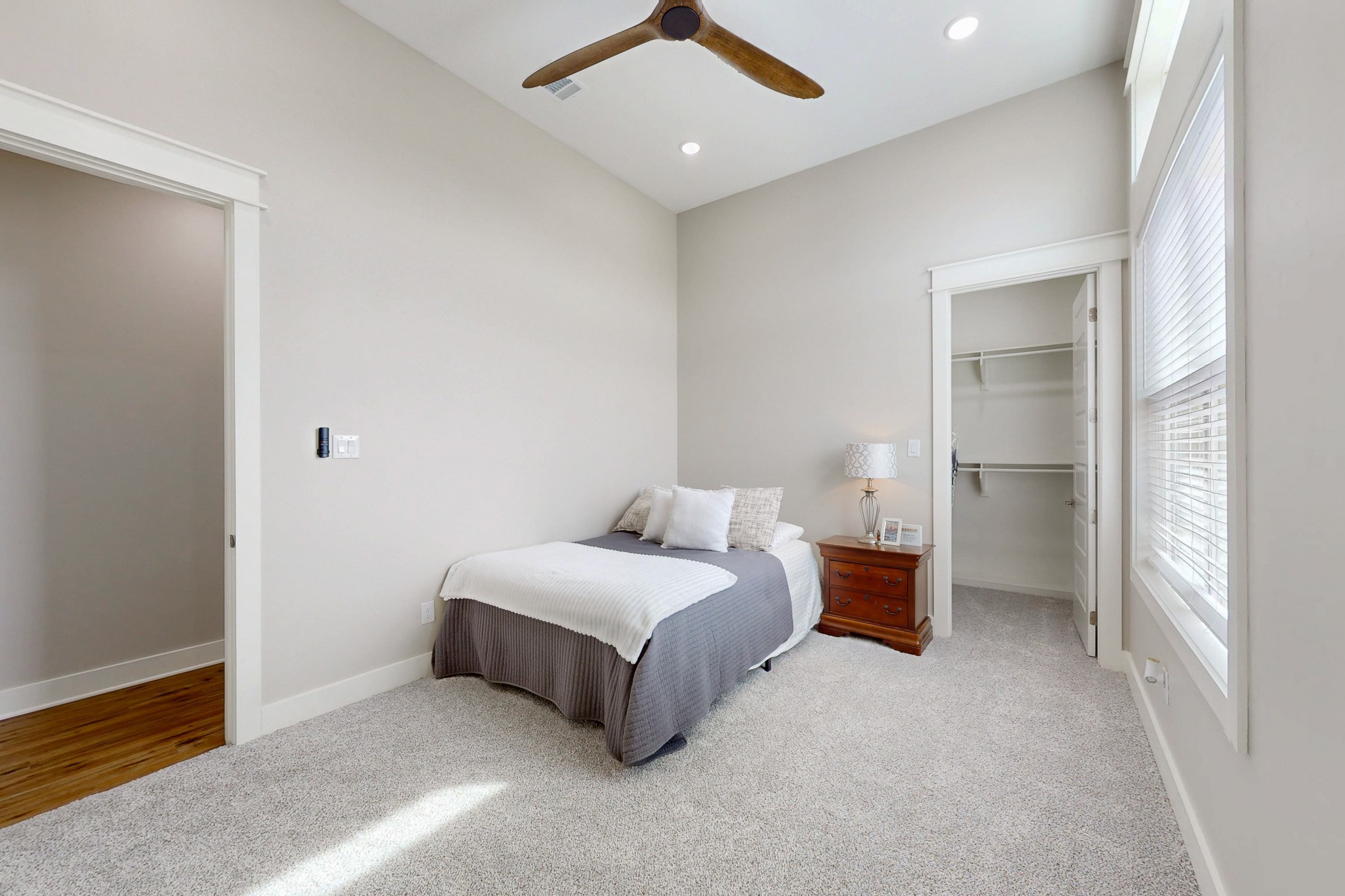13504 Hudson Farms Road Franklin, TX 77856 - Photo 20 of 49 a bedroom with a bed and a chandelier