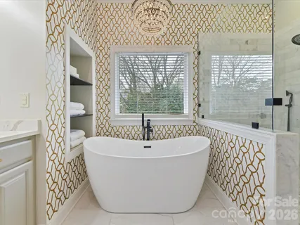a white bath tub sitting next to a window