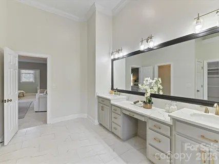 a bathroom with a sink double vanity and a mirror