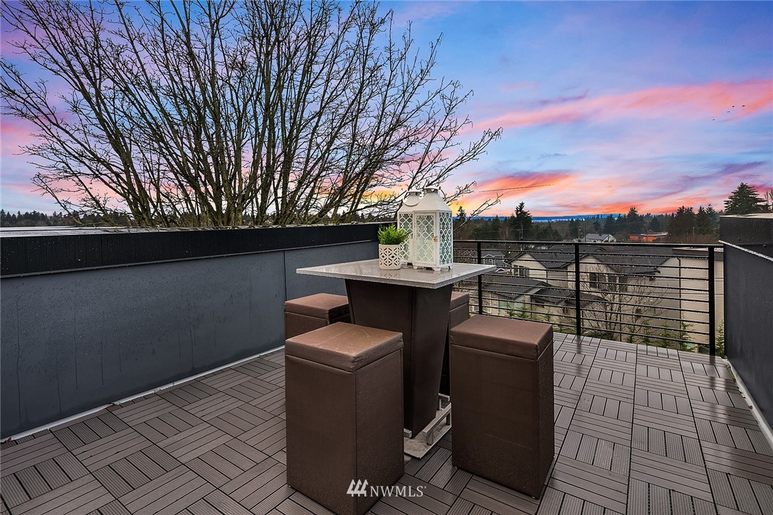 10158 A Holman Road Northwest Seattle, WA 98133 - Photo 17 of 21 a view of a patio with couches and wooden fence