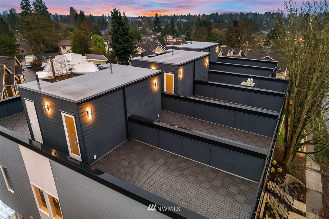 10158 A Holman Road Northwest Seattle, WA 98133 - Photo 21 of 21 a view of a balcony with chairs and wooden fence