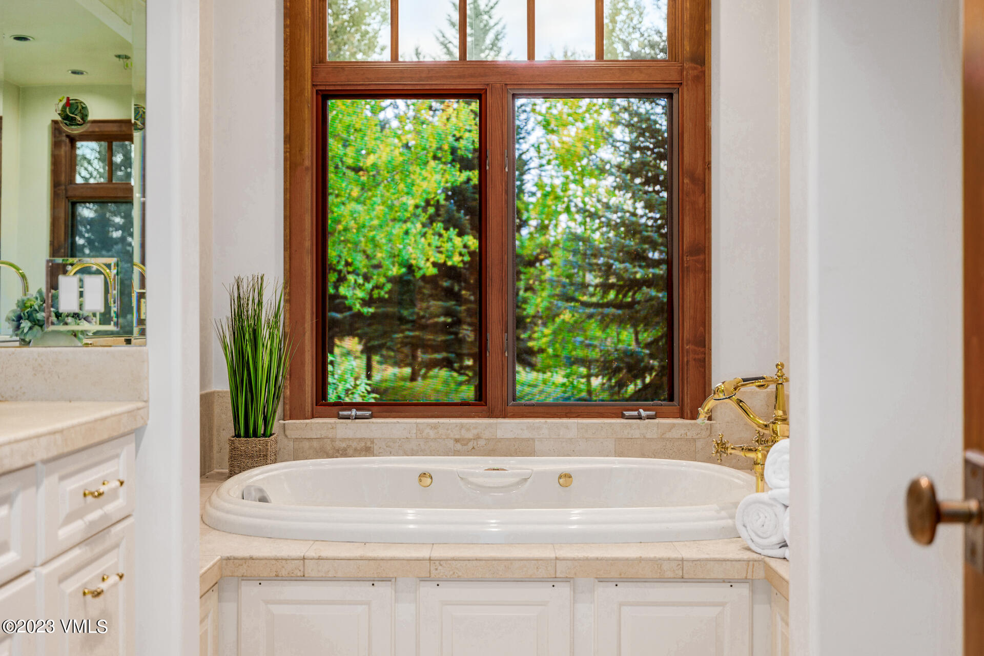 983 Beard Creek Road Edwards, CO 81632 - Photo 22 of 29 a white bath tub sitting next to a window