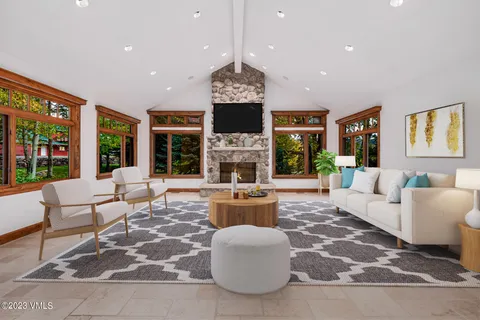 a living room with fireplace furniture and a fireplace