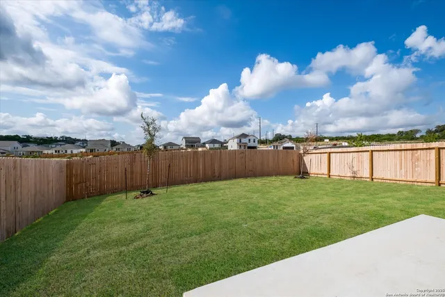 a view of a backyard with green space