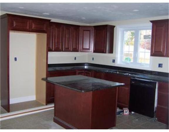 Lot 29 Bronson Street Fall River, MA 02721 - Photo 3 of 5 a kitchen with a sink refrigerator and cabinets