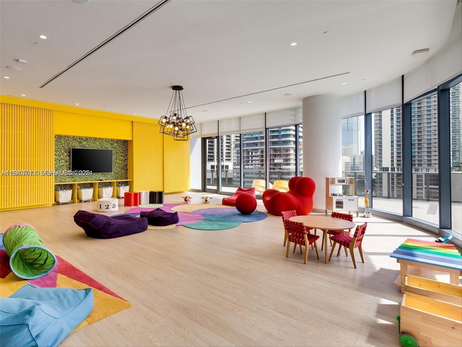 45 Southwest 9th Street, Unit 3107 Miami, FL 33130 - Photo 12 of 12 a view of a dining room with furniture and chandelier