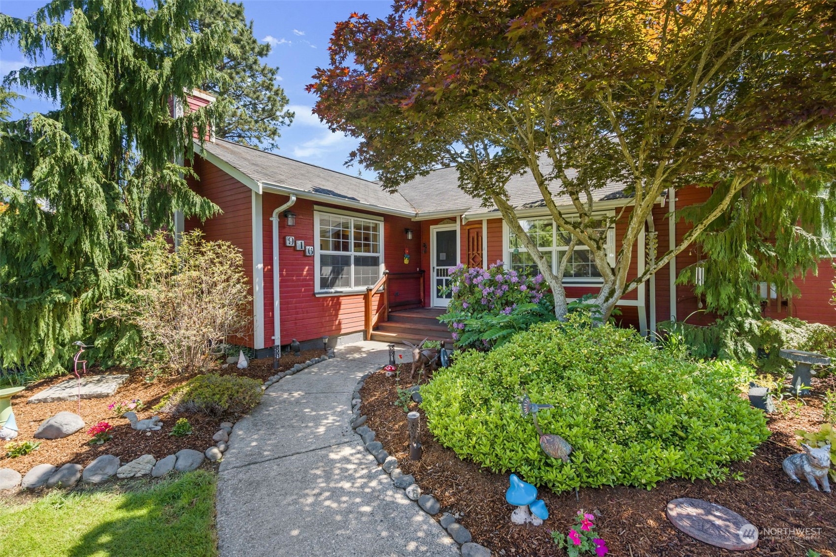 front view of a house with a tree