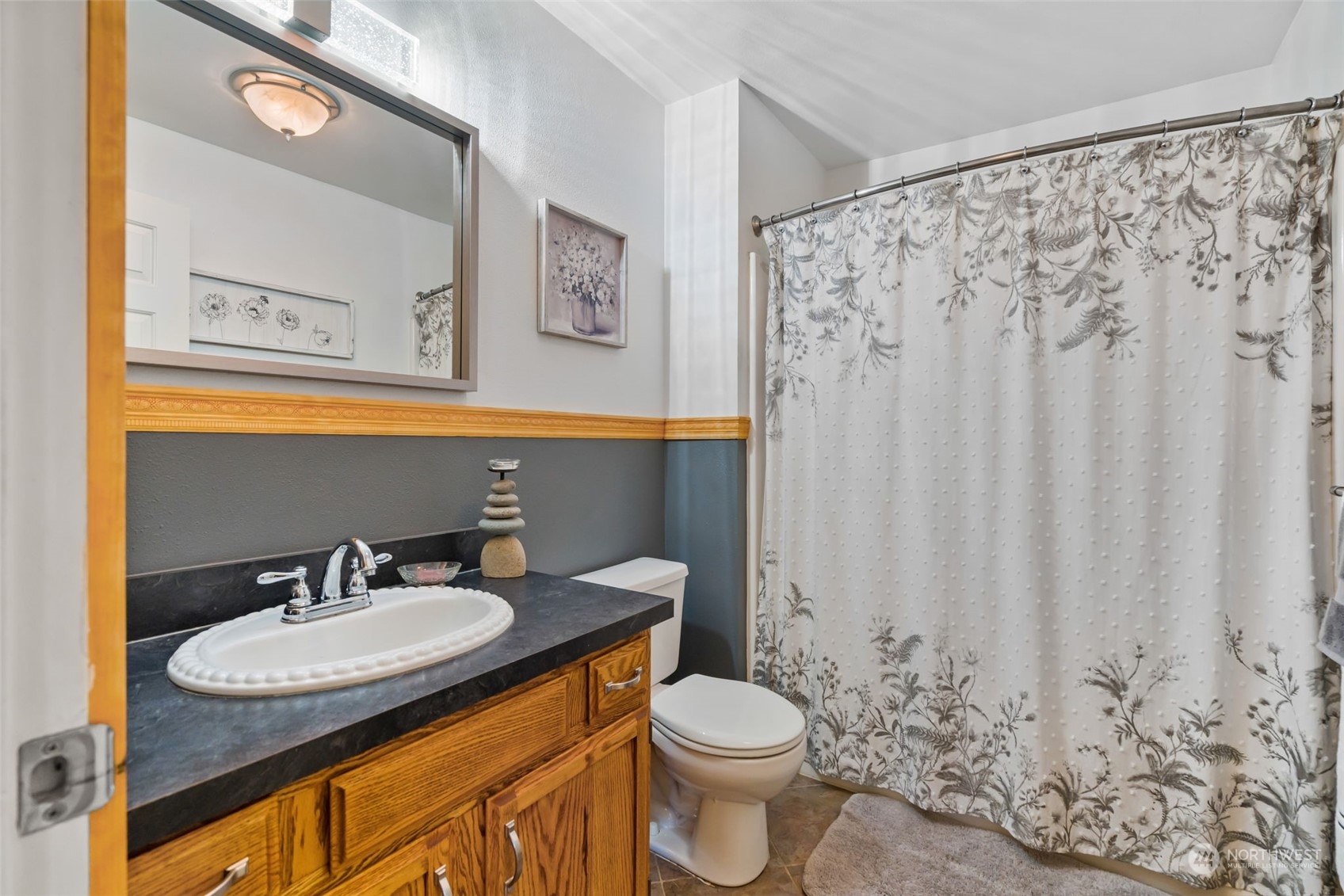 916 McLeod Road Bellingham, WA 98226 - Photo 19 of 40 a bathroom with a granite countertop sink and a mirror