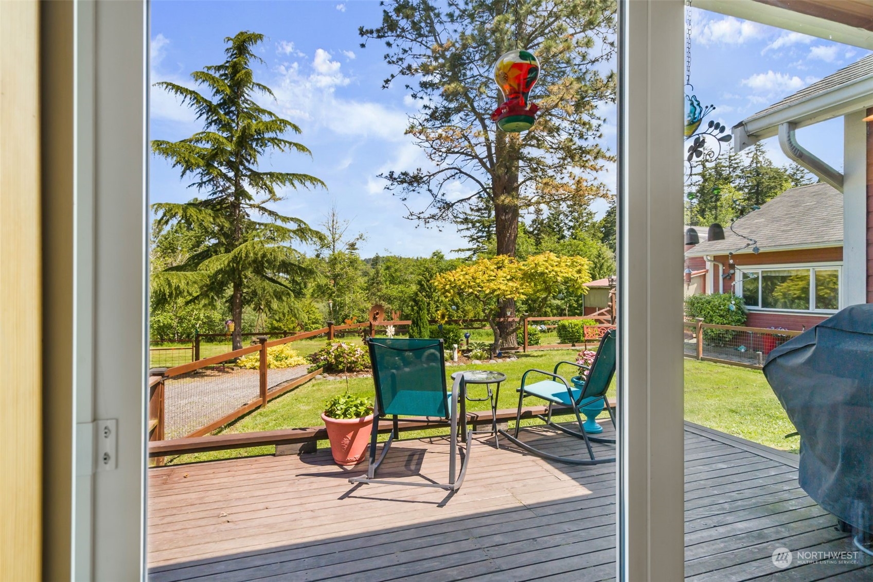 916 McLeod Road Bellingham, WA 98226 - Photo 21 of 40 a view of a porch with dining table and wooden floor
