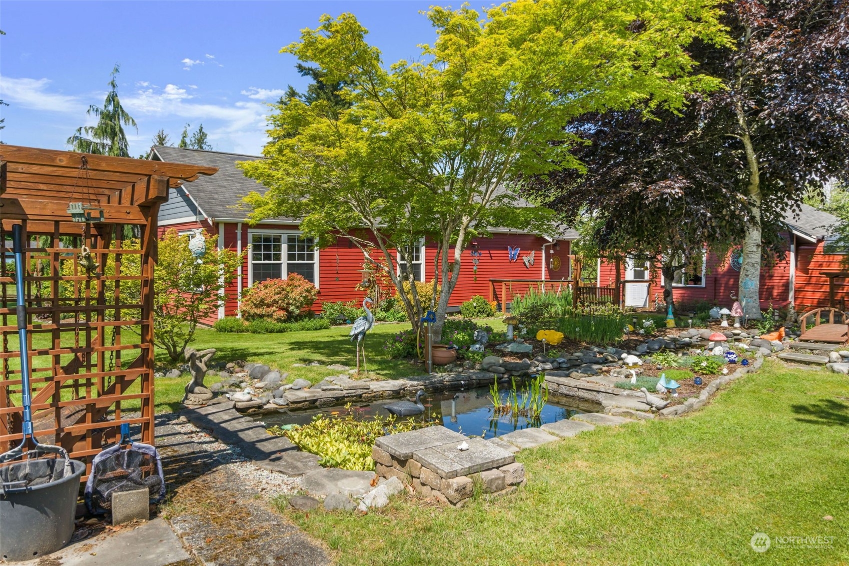 916 McLeod Road Bellingham, WA 98226 - Photo 24 of 40 a backyard of a house with yard table and chairs