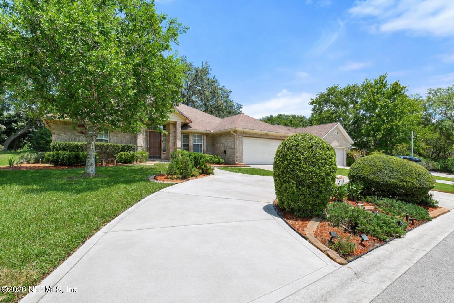 12223 Springmoor One Court Jacksonville, FL 32225 - Photo 2 of 29 a front view of a house with a yard