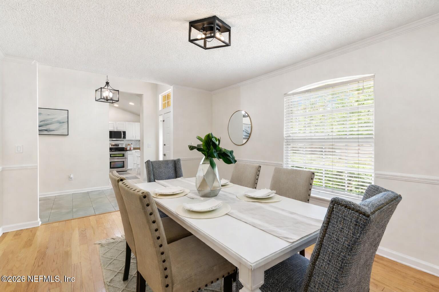 12223 Springmoor One Court Jacksonville, FL 32225 - Photo 5 of 29 a view of a dining room with furniture