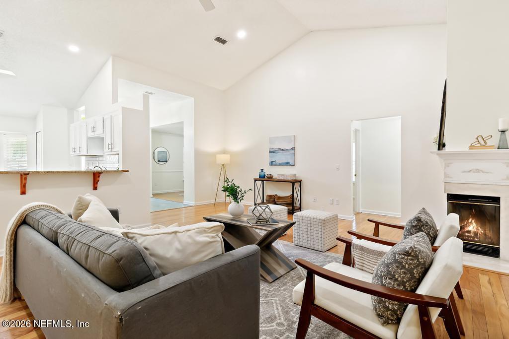 12223 Springmoor One Court Jacksonville, FL 32225 - Photo 8 of 29 a living room with furniture and a fireplace