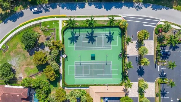 an aerial view of a house with a yard
