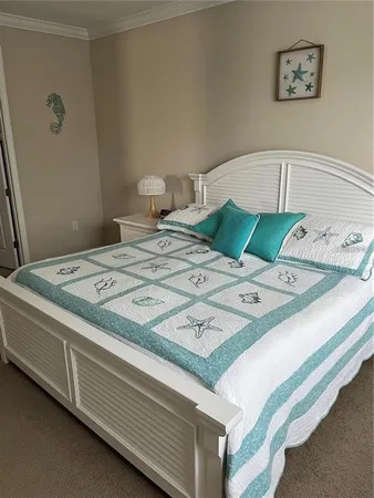 a bed sitting in a bedroom next to a baby crib