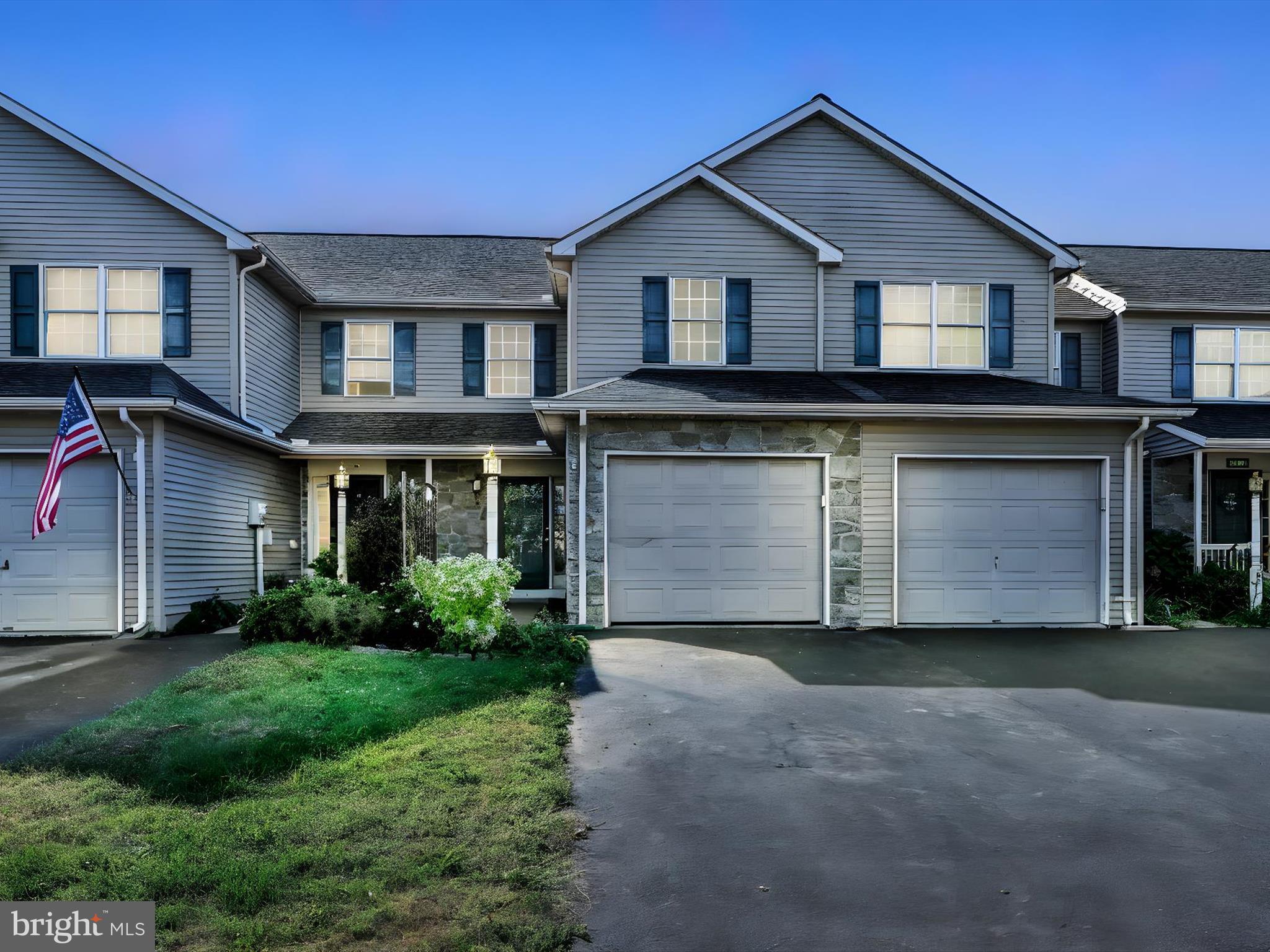 70 Pebble Creek Drive Lititz, PA 17543 - Photo 1 of 26 a front view of a house with a garden and yard