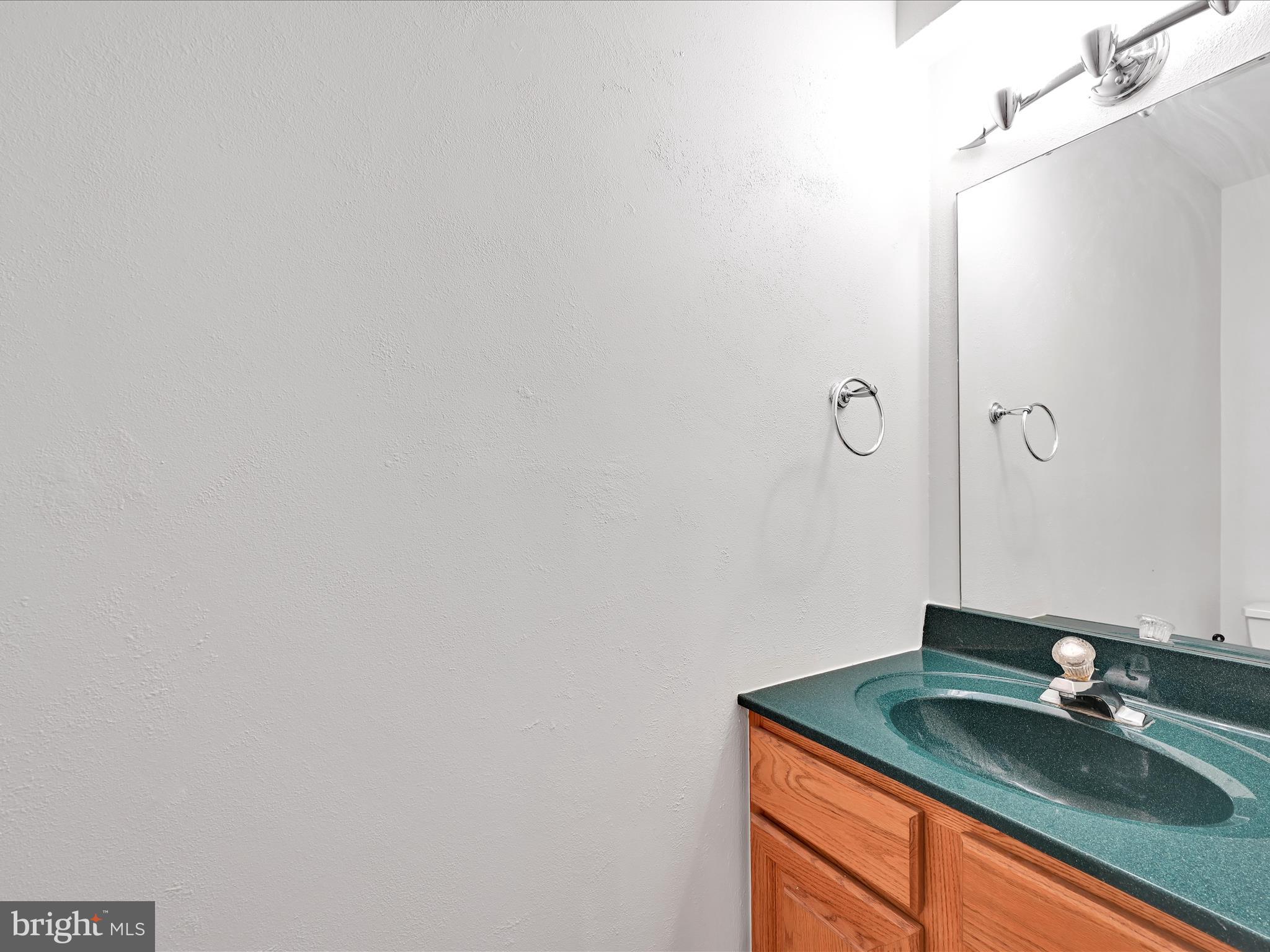 70 Pebble Creek Drive Lititz, PA 17543 - Photo 13 of 26 a bathroom with a granite countertop sink and vanity