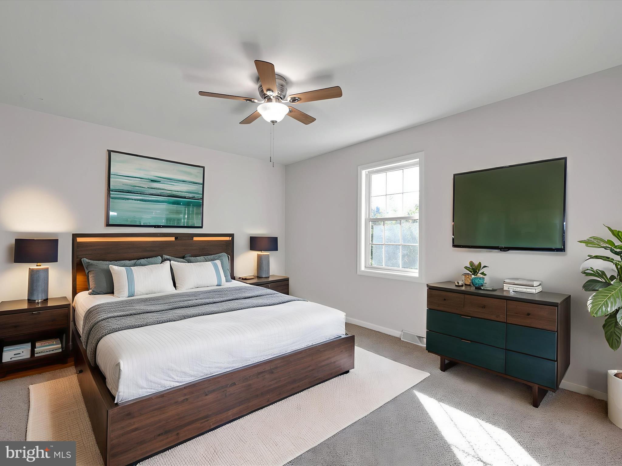 70 Pebble Creek Drive Lititz, PA 17543 - Photo 6 of 26 a bedroom with a bed and a flat screen tv