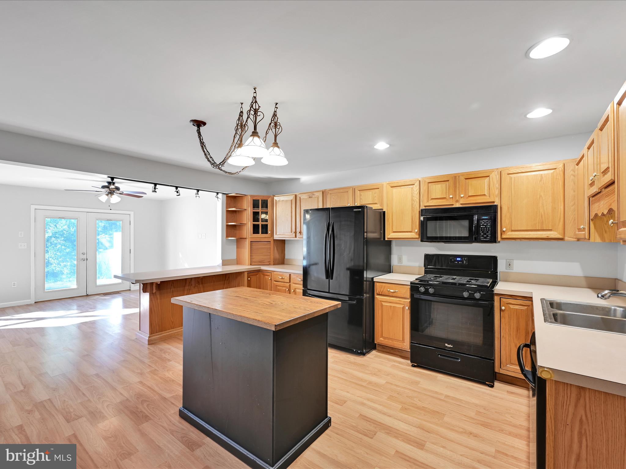 70 Pebble Creek Drive Lititz, PA 17543 - Photo 9 of 26 a kitchen with stainless steel appliances granite countertop a sink stove and refrigerator