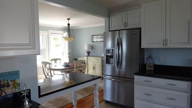 54 Jefferson Shores Road Buzzards Bay, MA 02532 - Photo 13 of 28 a kitchen with stainless steel appliances granite countertop a refrigerator and a stove