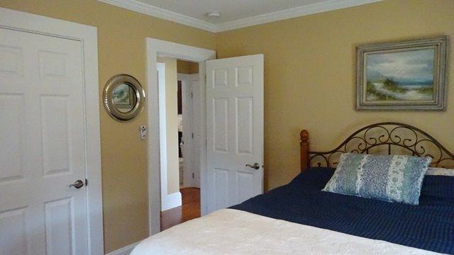 54 Jefferson Shores Road Buzzards Bay, MA 02532 - Photo 14 of 28 a bedroom with a bed and a table in it