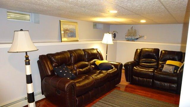 54 Jefferson Shores Road Buzzards Bay, MA 02532 - Photo 18 of 28 a living room with furniture and a lamp