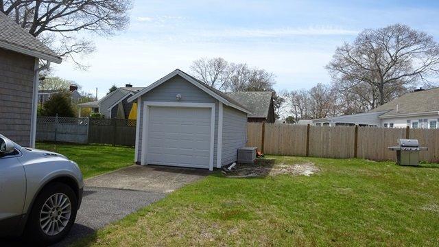 54 Jefferson Shores Road Buzzards Bay, MA 02532 - Photo 20 of 28 a view of a backyard of the house