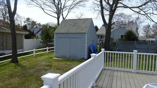 54 Jefferson Shores Road Buzzards Bay, MA 02532 - Photo 21 of 28 a view of a house with a backyard