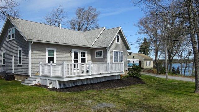 54 Jefferson Shores Road Buzzards Bay, MA 02532 - Photo 24 of 28 a view of a house with a yard