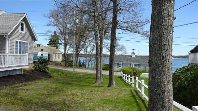 54 Jefferson Shores Road Buzzards Bay, MA 02532 - Photo 3 of 28 a view of a house with backyard and a tree