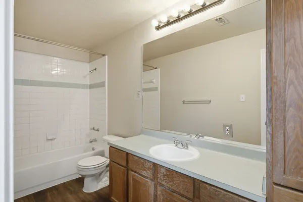 a bathroom with a toilet a sink and a bathtub