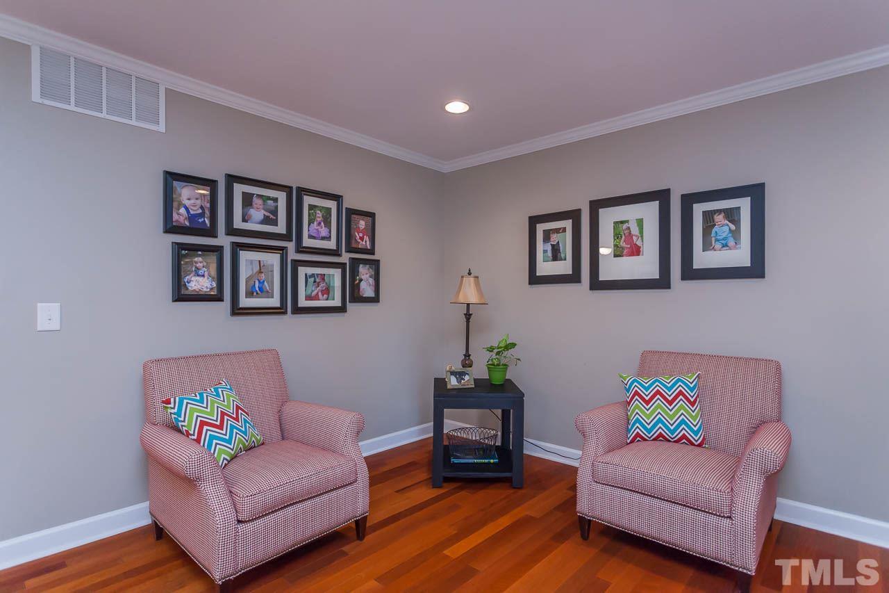 3145 Merrianne Drive Raleigh, NC 27607 - Photo 12 of 25 a living room with furniture and a wooden floor