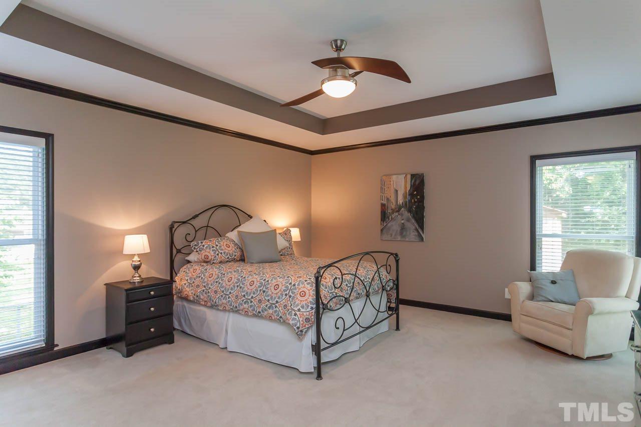 3145 Merrianne Drive Raleigh, NC 27607 - Photo 15 of 25 a bedroom with a bed couch and window