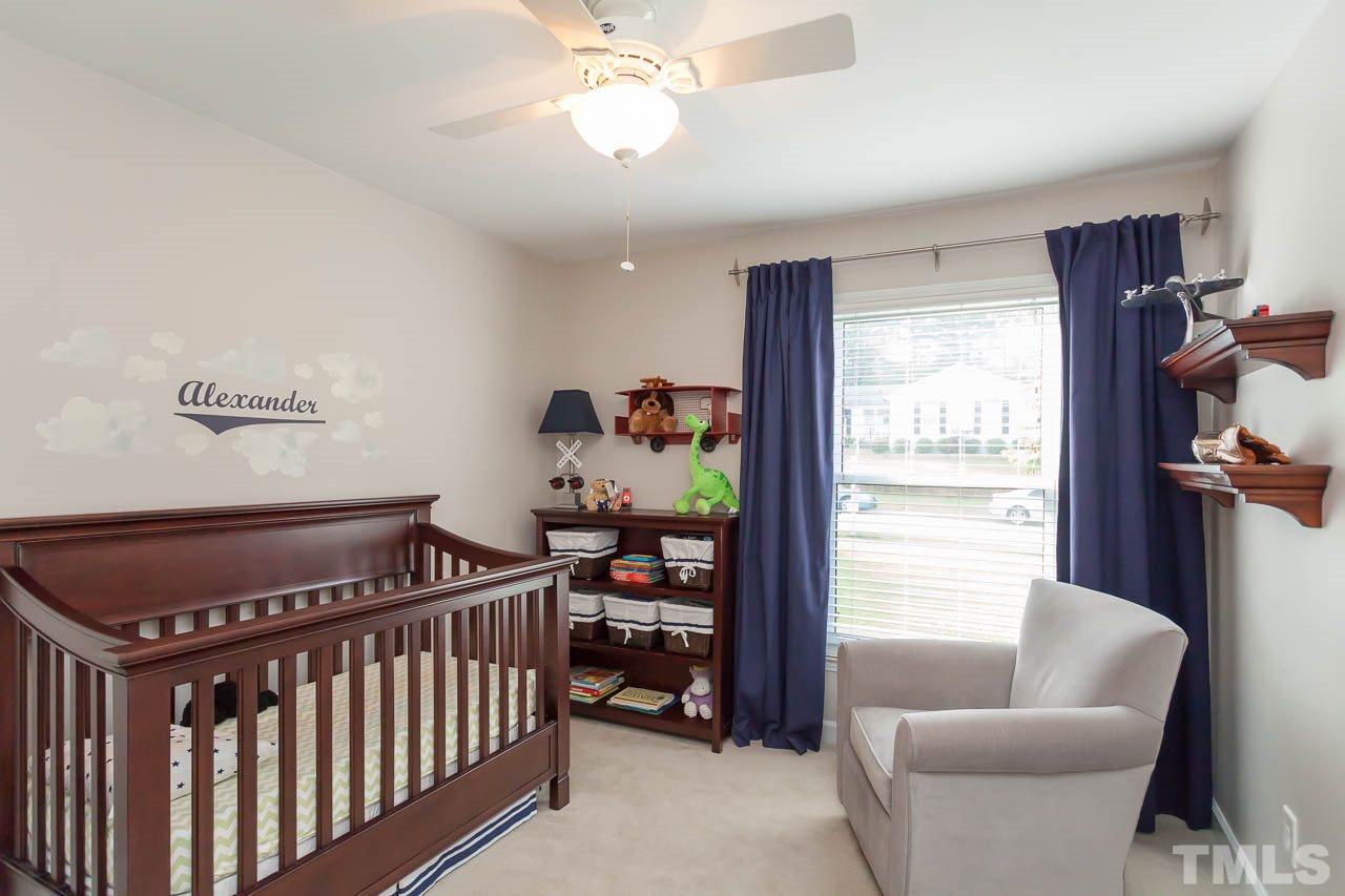 3145 Merrianne Drive Raleigh, NC 27607 - Photo 20 of 25 a bedroom with furniture and a window