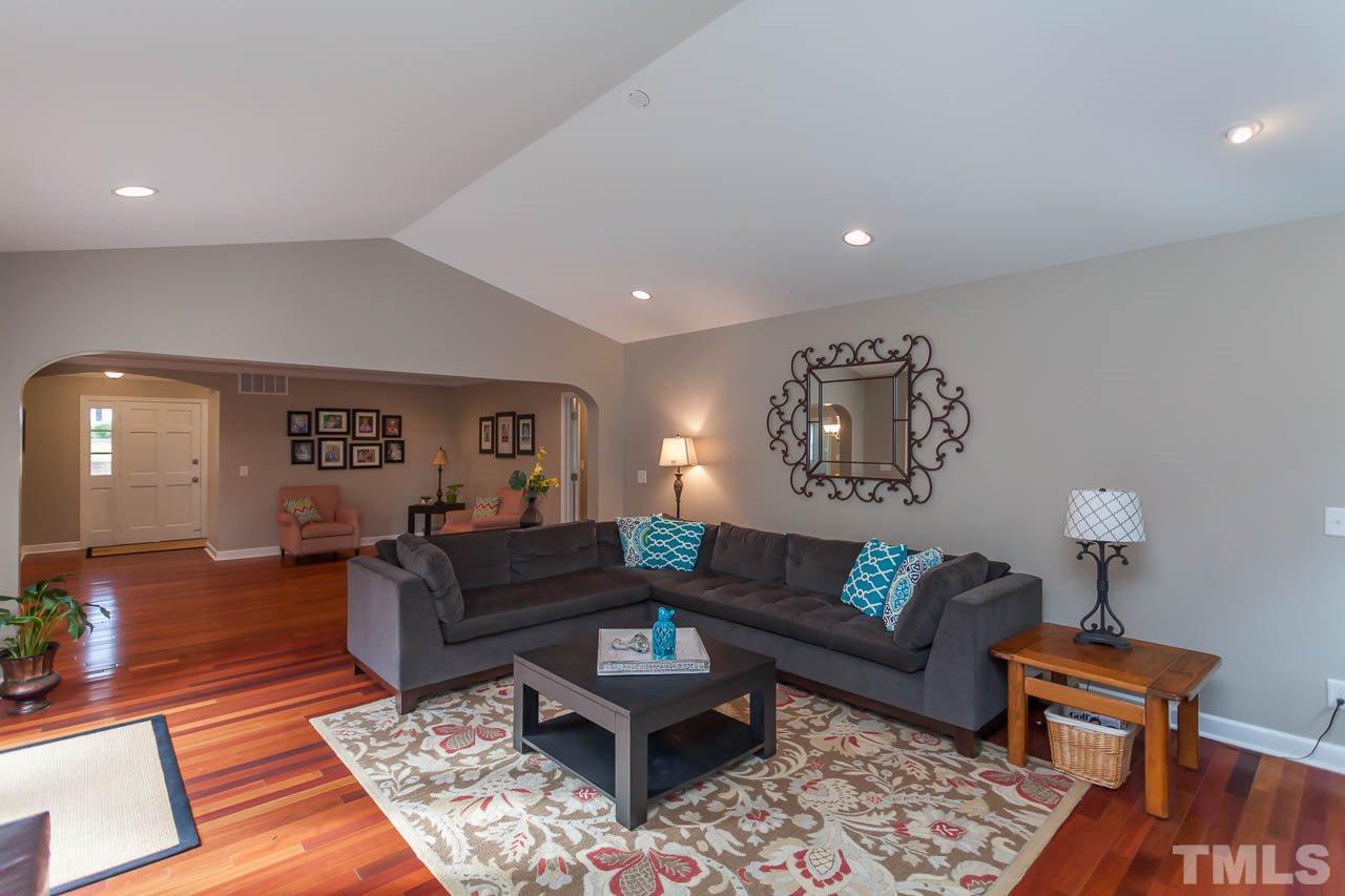 3145 Merrianne Drive Raleigh, NC 27607 - Photo 6 of 25 a living room with furniture and a wooden floor