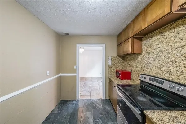 a kitchen with a stove and a sink