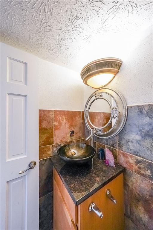 400 Winding River Drive, Unit E Atlanta, GA 30350 - Photo 15 of 34 a kitchen with a stove and a sink