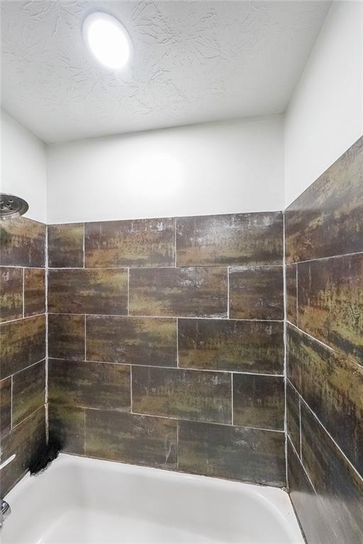 400 Winding River Drive, Unit E Atlanta, GA 30350 - Photo 20 of 34 a bathroom with a shower