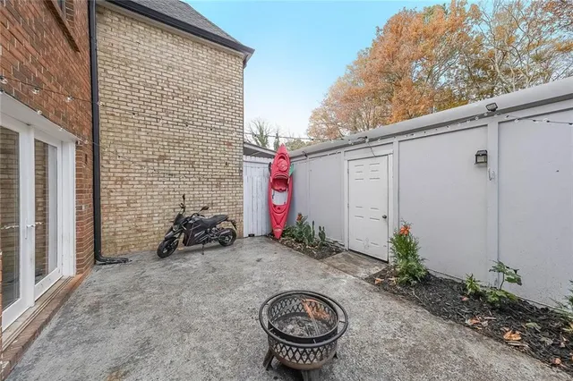 a backyard of a house with potted plants