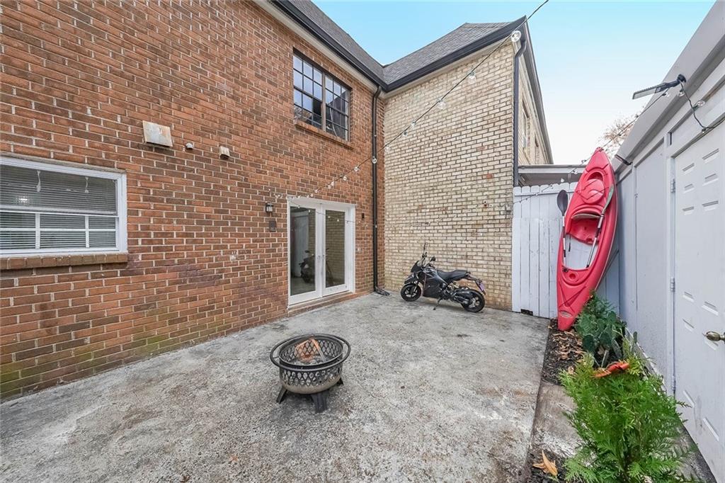 400 Winding River Drive, Unit E Atlanta, GA 30350 - Photo 29 of 34 a backyard of a house with potted plants