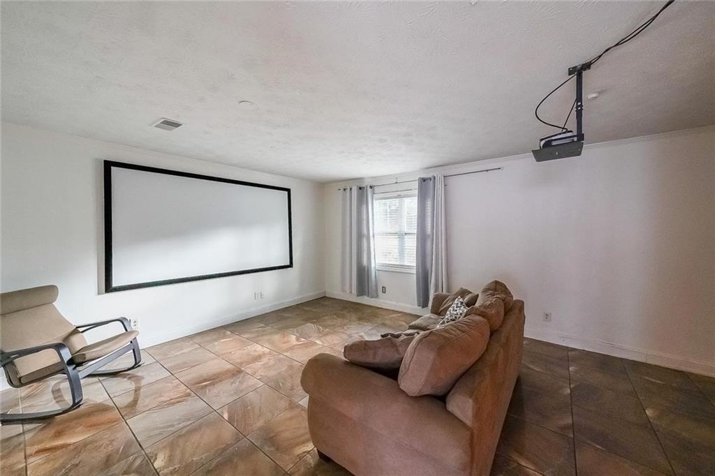 400 Winding River Drive, Unit E Atlanta, GA 30350 - Photo 6 of 34 a living room with furniture and a window